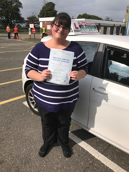 Happy student Sarah with her driving certificate