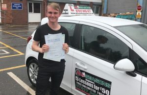 Young driver with certificate and instructor