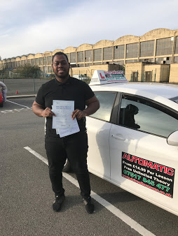 Happy student with driving certificate and car keys